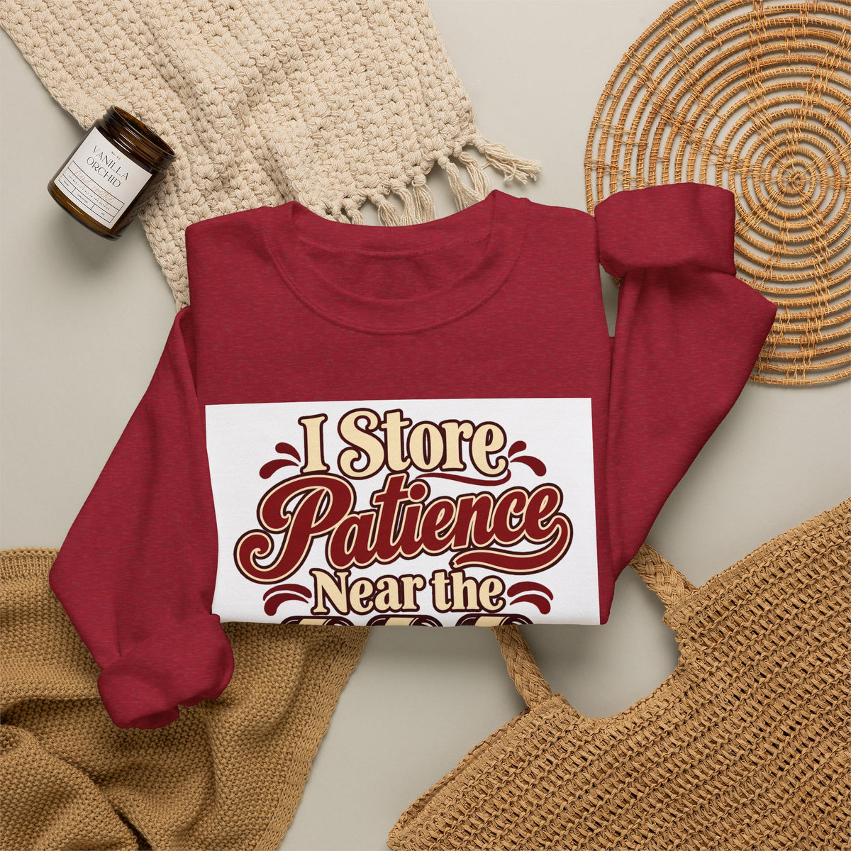 Wine Rack Patience Sweatshirt in red, folded front view with printed design