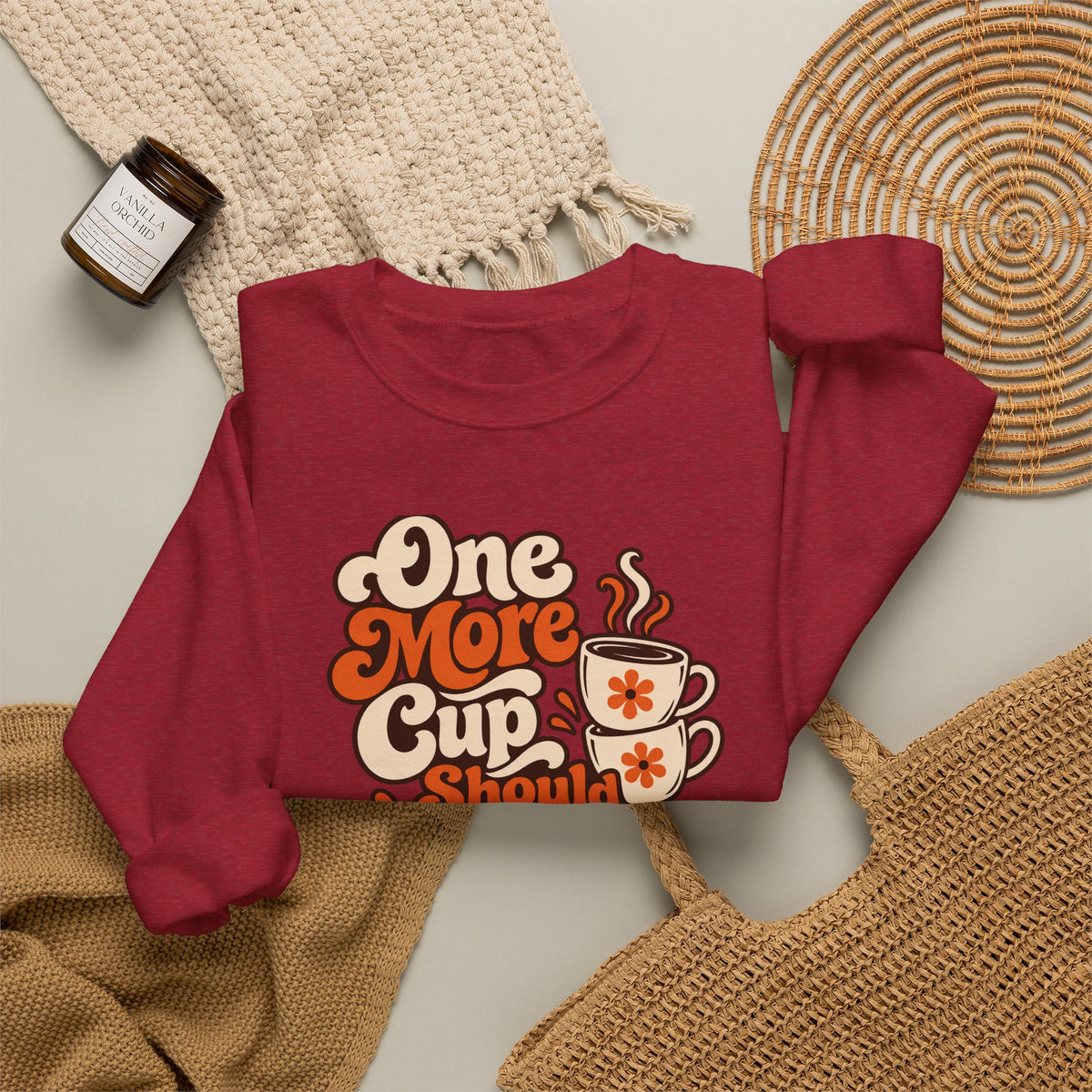 One More Cup Vintage Sweatshirt in red, folded front view with printed design