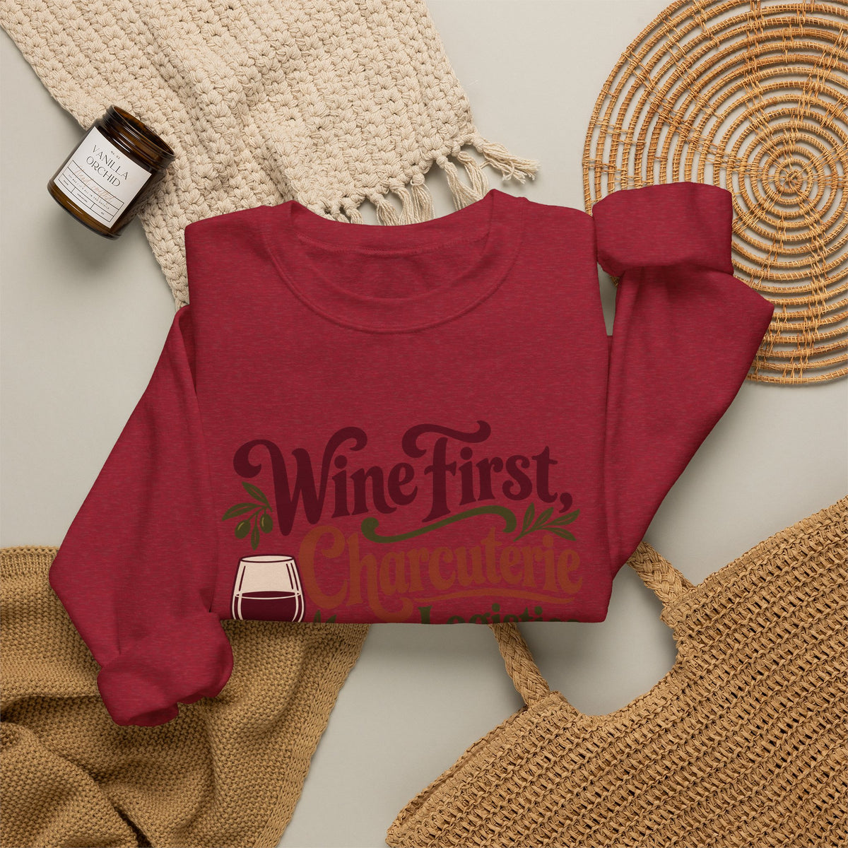 Charcuterie Logistics Wine Sweatshirt in red, folded front view with printed design