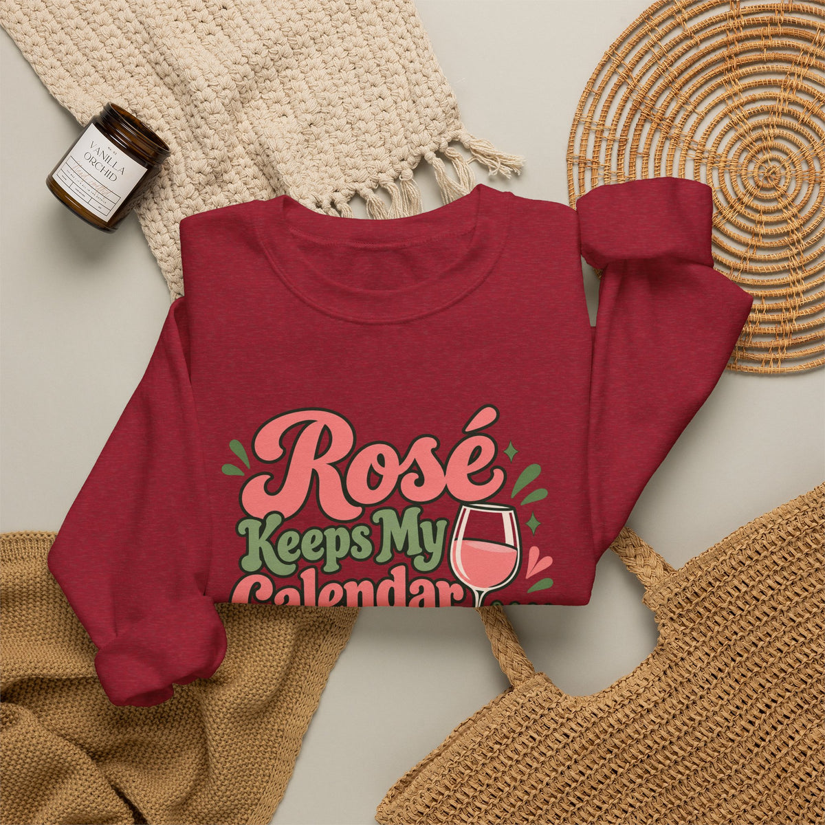 Rosé Calendar Retro Sweatshirt in red, folded front view with printed design