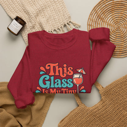 Tiny Vacation Wine Sweatshirt in red, folded front view with printed design