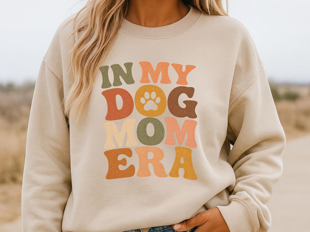 Sand sweatshirt with retro In My Dog Mom Era lettering and a paw print