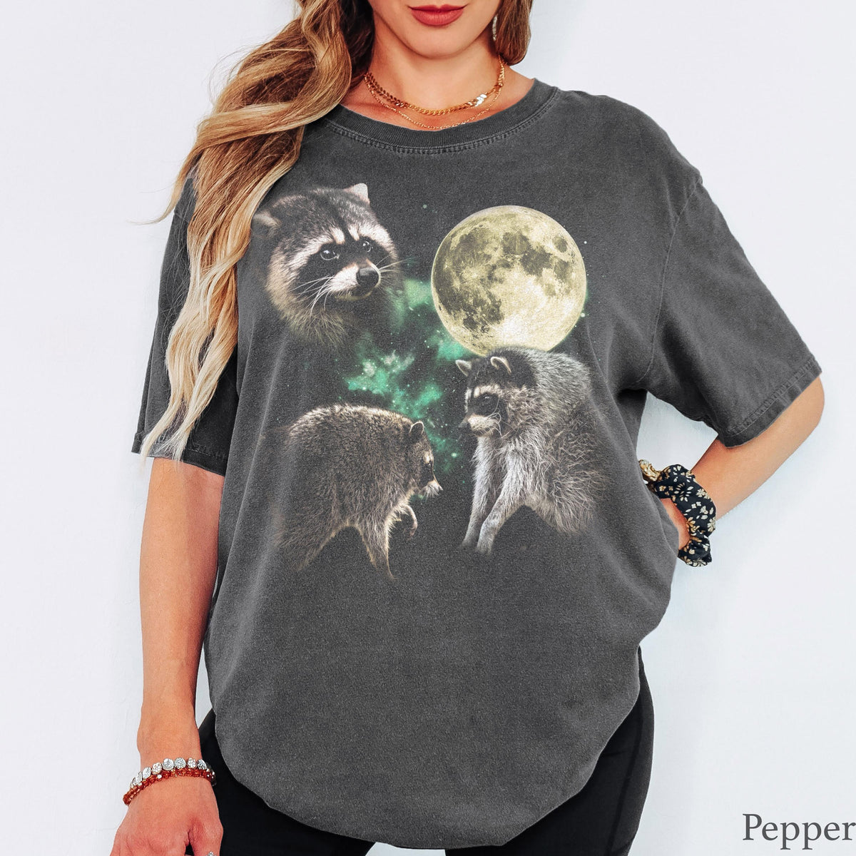 Pepper T-shirt with three raccoons, a full moon and green night-sky accents