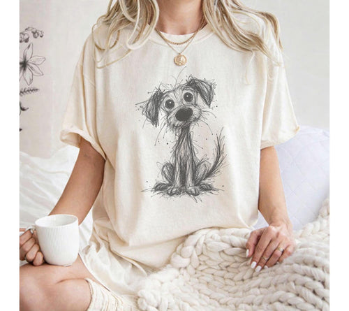 Ivory T-shirt with a wide-eyed puppy drawn in scribbled black lines