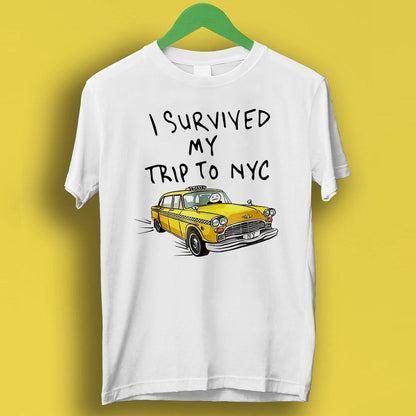 May include: White t-shirt with the text "I survived my trip to NYC" and a cartoon yellow taxi cab.