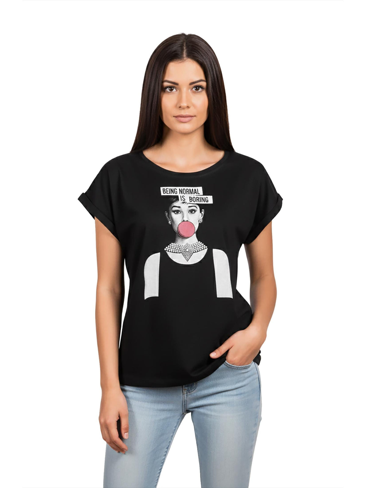May include: Black t-shirt featuring a graphic of a woman with a bubblegum bubble and the text "BEING NORMAL IS BORING". The shirt has a round neck and short sleeves. The model is wearing light blue jeans.