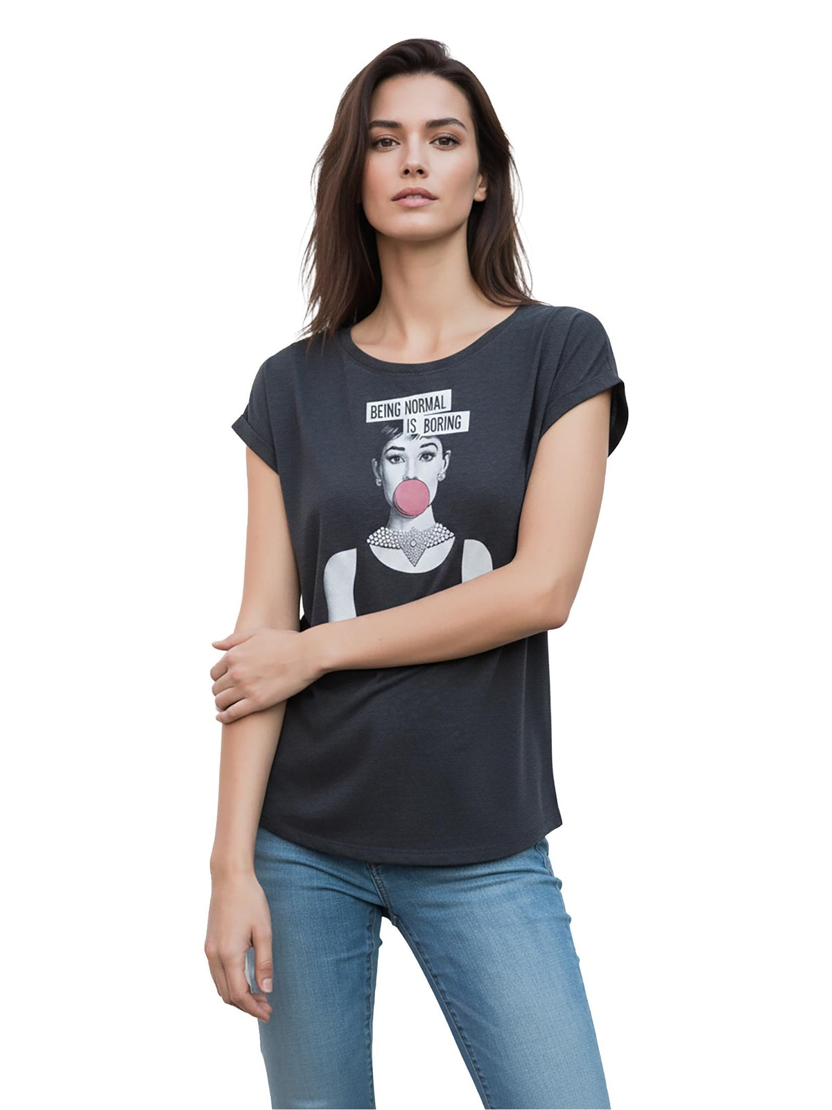 May include: Dark gray t-shirt with a graphic of a woman blowing a bubblegum bubble, with the text "BEING NORMAL IS BORING". The woman is wearing a pearl necklace. The model is wearing blue jeans.