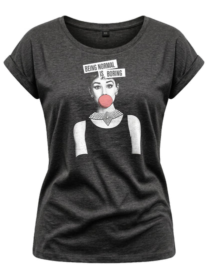 May include: Dark gray t-shirt with rolled sleeves featuring a graphic of a woman with a bubblegum bubble and the text "BEING NORMAL IS BORING". The woman is wearing a pearl necklace and earrings.