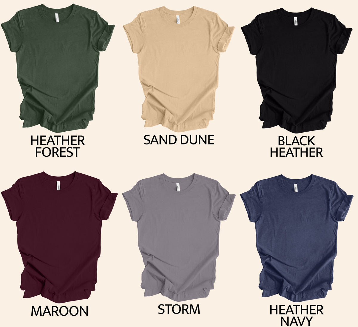 May include: Six different color t-shirts with a ruffled bottom. The colors are Heather Forest, Sand Dune, Black Heather, Maroon, Storm, and Heather Navy.