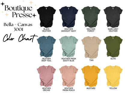 May include: Color chart for Bella + Canvas 3001 t-shirts. The chart shows 12 different colors, including black heather, midnight navy, heather forest, dark grey heather, heather deep teal, heather prism dusty blue, tan, olive, heather orchid, heather prism peach, mustard, and yellow.