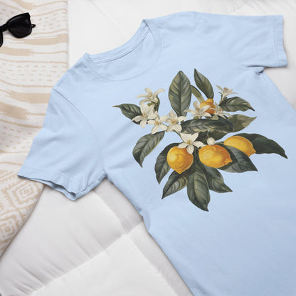 May include: A light blue t-shirt with a floral print of a lemon tree with white blossoms and yellow lemons.