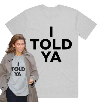 May include: A gray t-shirt with the text "I TOLD YA" printed in black.
