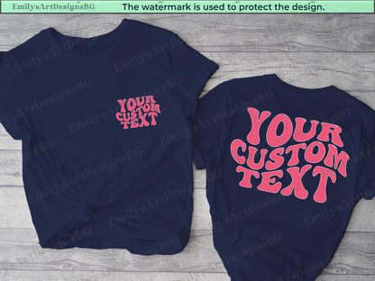 May include: Two navy blue t-shirts with the text "YOUR CUSTOM TEXT" in pink. The text on the left shirt is smaller and on the right shirt is larger and in a retro font.