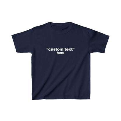 May include: A navy blue t-shirt with the text "custom text" above the word "here" in white. The shirt is a short-sleeved, crew neck style, suitable for casual wear. The text is centered on the front of the shirt.