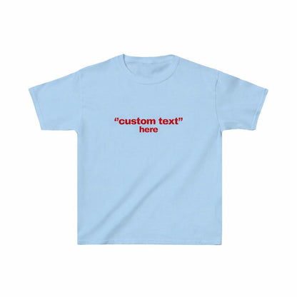 May include: Light blue t-shirt with short sleeves. The shirt features the red text "custom text" above the word "here". The shirt is made of a soft material and is suitable for casual wear.