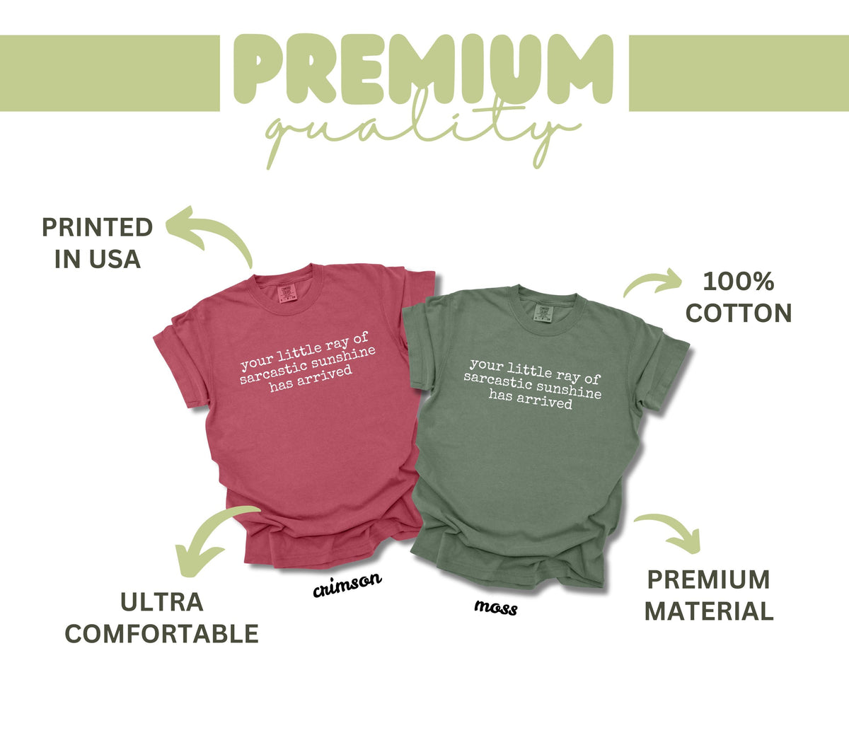 May include: Two short-sleeved t-shirts, one crimson and one moss green, are displayed. Each shirt features the phrase "your little ray of sarcastic sunshine has arrived" in white text. The shirts are made of 100% cotton and are ultra comfortable.