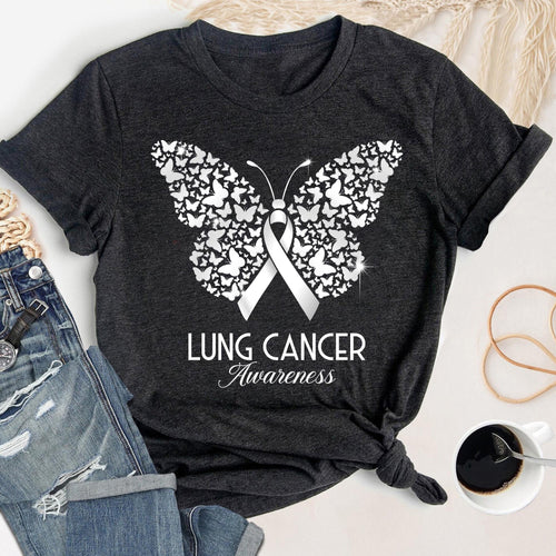 May include: Dark gray t-shirt featuring a white butterfly design composed of smaller butterflies. A white ribbon is centered within the butterfly, with the words "LUNG CANCER Awareness" printed below in white script.