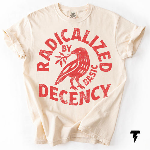 May include: Cream-colored t-shirt with rolled-up sleeves. The front features a distressed red graphic of a bird holding a sprig, encircled by the words "RADICALIZED BY BASIC DECENCY."