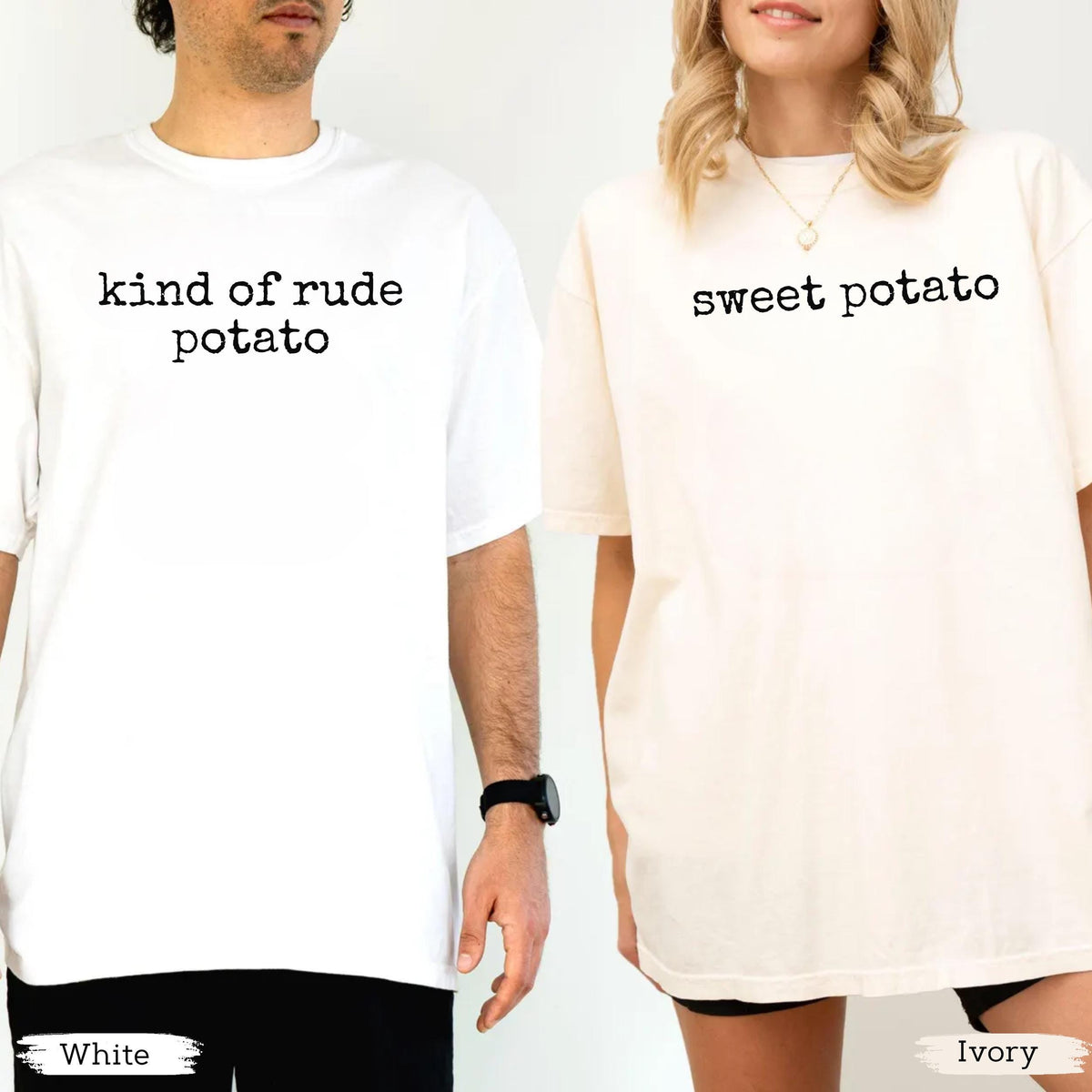 May include: Two t-shirts, one white and one ivory, with black text. The white shirt says "kind of rude potato," and the ivory shirt says "sweet potato." Both shirts are short-sleeved and have a casual fit.
