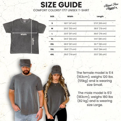 May include: A size guide for a Comfort Colors 1717 unisex t-shirt featuring a charcoal gray shirt, a table of measurements in inches, and two models wearing the shirt and matching caps. The text includes sizing from S to 4XL with width and length.