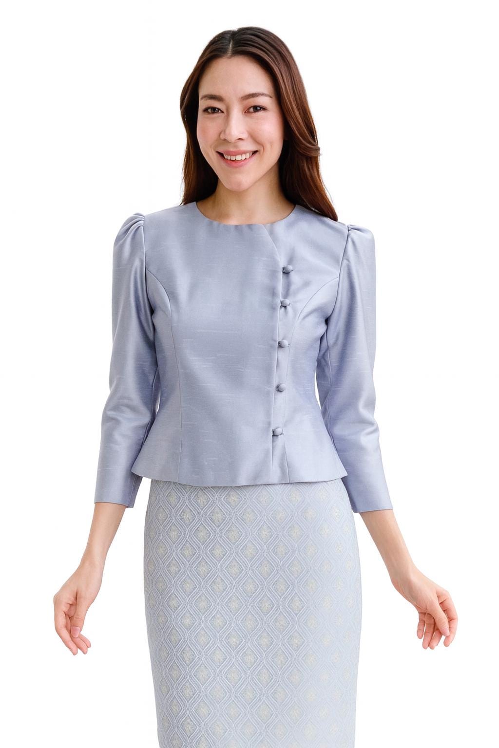 May include: A light blue, two-piece outfit featuring a long-sleeved top with button details and a matching skirt. The top has a round neckline and the skirt has a geometric pattern. The outfit is made of a shiny fabric.