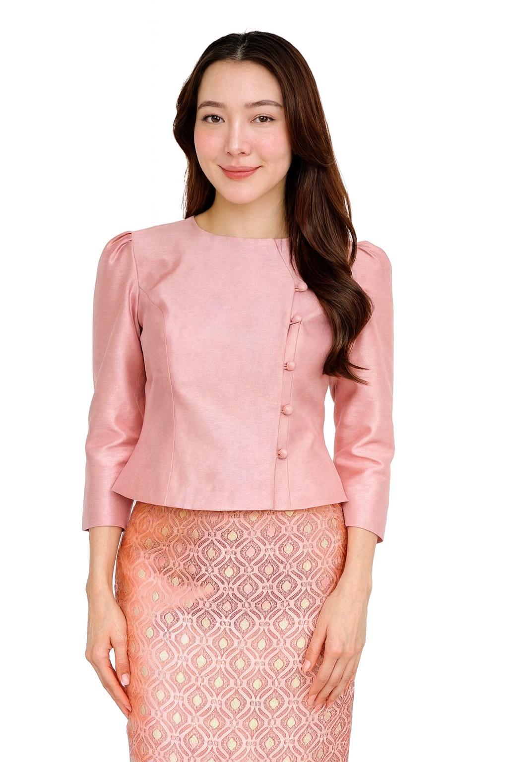 May include: A light pink blouse with three-quarter sleeves and a round neckline. The blouse features a button closure on the side and is paired with a patterned skirt. The outfit is a traditional style, suitable for formal occasions.