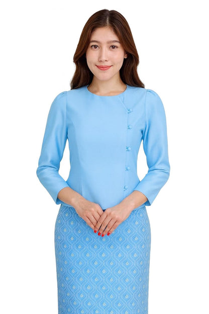 May include: A light blue blouse with long sleeves and a row of buttons on the side. The blouse is paired with a matching blue patterned skirt. The outfit is a traditional style, suitable for formal occasions.