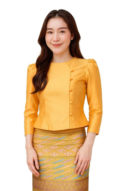 May include: A golden yellow blouse with three-quarter sleeves and a mandarin collar, paired with a patterned skirt. The blouse features a row of buttons down the side. The skirt has a floral and geometric design.