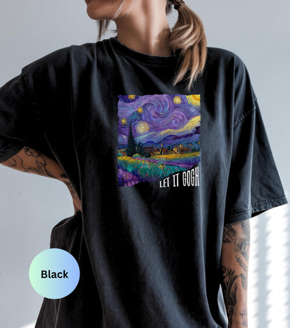 May include: Black t-shirt featuring a square print of Van Gogh's "Starry Night" painting with the text "LET IT GOGH" in white. The artwork depicts a swirling night sky with stars and a village. The shirt is a comfortable, casual style.