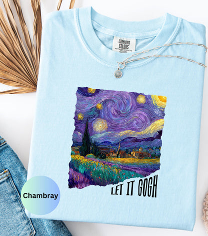 May include: Light blue Comfort Colors t-shirt featuring a vibrant print of Van Gogh's "Starry Night" painting. The design includes swirling blues, purples, and yellows, with the text "LET IT GOGH" in black. A silver necklace with a sun pendant is visible.