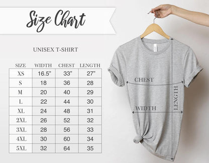 May include: A light gray unisex t-shirt hanging on a wooden hanger. The image includes a size chart with measurements in inches for width, chest, and length, ranging from XS to 5XL. The chart is labeled "Size Chart".
