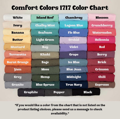 May include: Color chart displaying Comfort Colors 1717 shades. The chart features a variety of colors, including white, ivory, banana, butter, mustard, terracotta, burnt orange, yam, grey, and granite. Other colors include island reef, chalky mint, seafoam, light green, bay, khaki, sage, moss, hemp, and blue spruce.