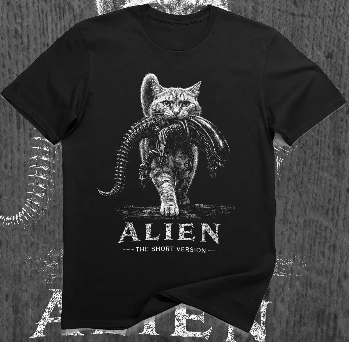 May include: A black short-sleeved t-shirt featuring a white graphic of a cat carrying an alien creature in its mouth. Below the graphic, the text reads ALIEN THE SHORT VERSION in a distressed white font. The design is centered on the chest.