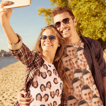 May include: A white t-shirt featuring a repeating pattern of multiple small, individual portrait photographs of a person's face printed across the entire fabric surface, worn by two individuals posing for a selfie outdoors in sunlight.