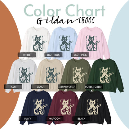 May include: A Gildan 18000 color chart featuring eleven crewneck sweatshirts in white, light blue, light pink, ash, sand, military green, forest green, navy, maroon, and black. Each sweatshirt displays a graphic of a cat playing a guitar.