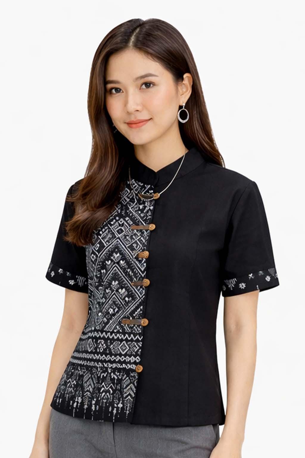 May include: Black short-sleeved shirt with a mandarin collar and decorative wooden buttons. The left side features a black and white geometric pattern. The sleeves have a small patterned border. A silver necklace is visible.