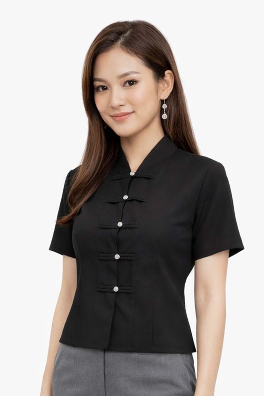 May include: A black short-sleeved blouse with a mandarin collar and a series of decorative buttons down the front. The blouse is made of a smooth fabric and has a tailored fit. The model is wearing the blouse.
