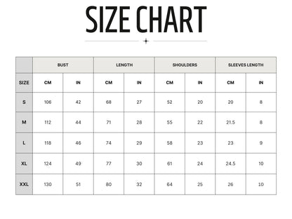 May include: A size chart with measurements in inches and centimeters. The chart includes bust, length, shoulders, and sleeve length measurements for sizes S, M, L, XL, and XXL. The chart shows the measurements in inches and centimeters.