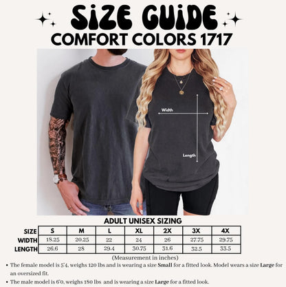 May include: Size guide for Comfort Colors 1717 t-shirts. The image shows a size chart with measurements in inches for adult unisex sizing, ranging from S to 4X. The chart includes width and length measurements. The text also mentions model sizing.