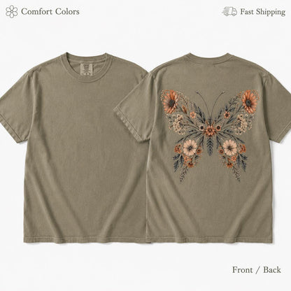 May include: A short-sleeved crew neck t-shirt in a muted olive green color. The front is plain, while the back features a large graphic of a butterfly composed of various orange, peach, and brown flowers, leaves, and stems on a dark background.