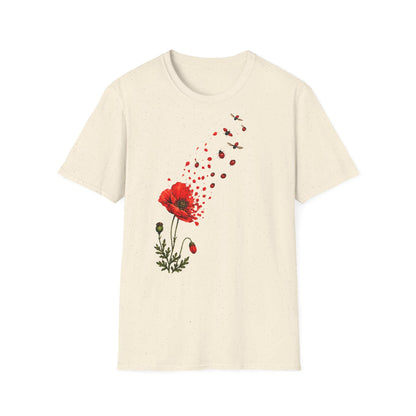 May include: A cream-colored short-sleeve t-shirt featuring a graphic print of a red poppy flower. The petals of the flower appear to be disintegrating into small red fragments and flying ladybugs that drift upward toward the right shoulder.