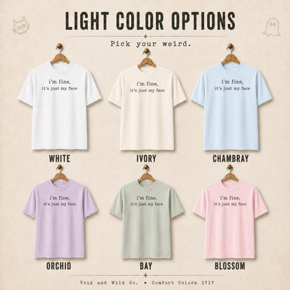 May include: Six short-sleeve t-shirts in white, ivory, chambray, orchid, bay, and blossom colors. Each shirt features the black text 'i'm fine, it's just my face' centered on the chest. The image includes the header 'LIGHT COLOR OPTIONS'.