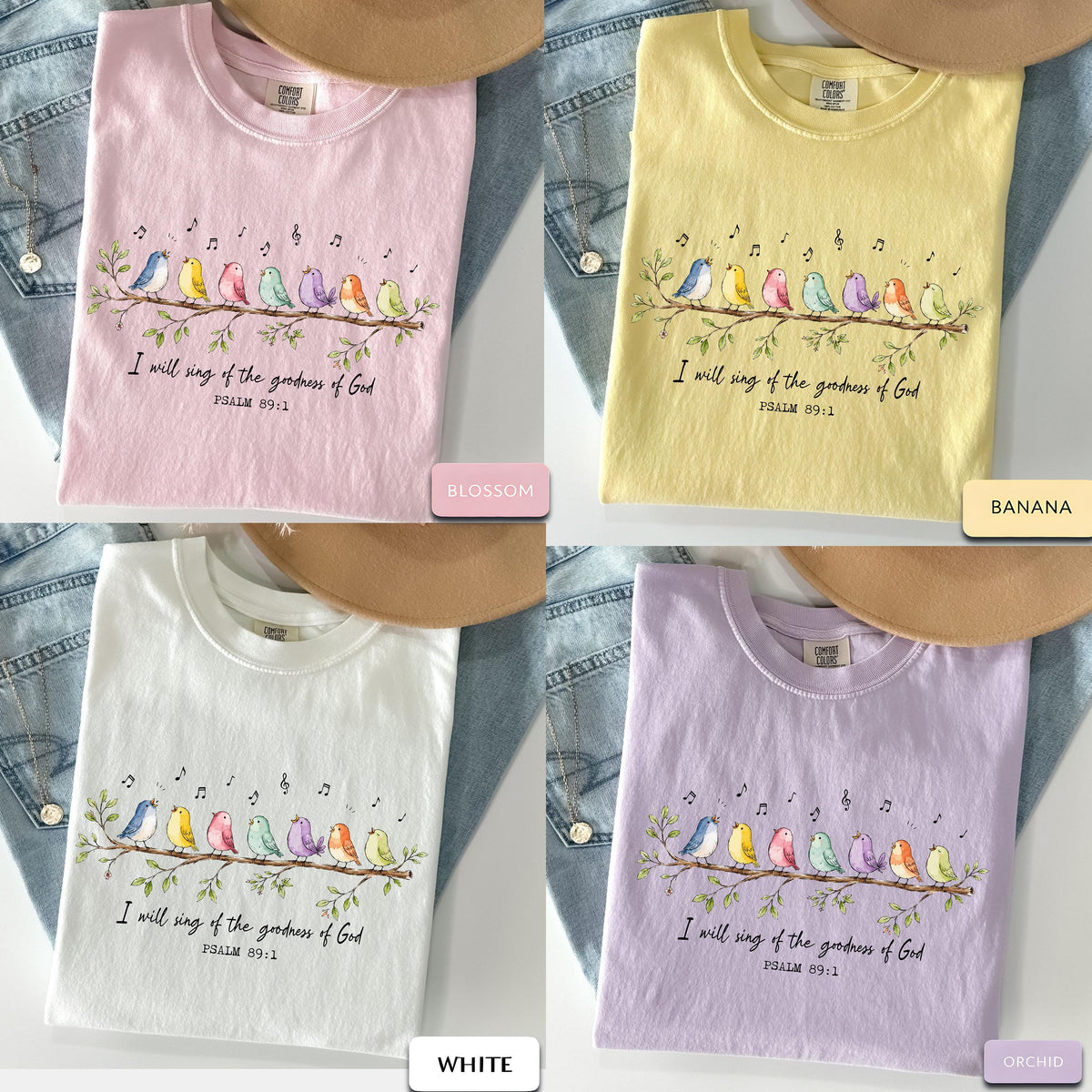 May include: Four short-sleeve t-shirts in blossom pink, banana yellow, white, and orchid purple. Each shirt features a graphic of seven colorful birds perched on a branch with musical notes and the text I will sing of the goodness of God PSALM 89:1.