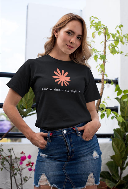 May include: A black short-sleeve t-shirt featuring a peach-colored stylized flower graphic centered on the chest above the white text that reads, "You're absolutely right -" paired with a dark blue denim skirt with distressed detailing.