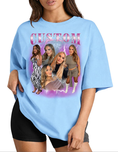May include: A light blue t-shirt featuring a graphic print with the word CUSTOM in pink metallic lettering. The design includes a collage of five photographs of the same person in various outfits, set against a purple lightning background.