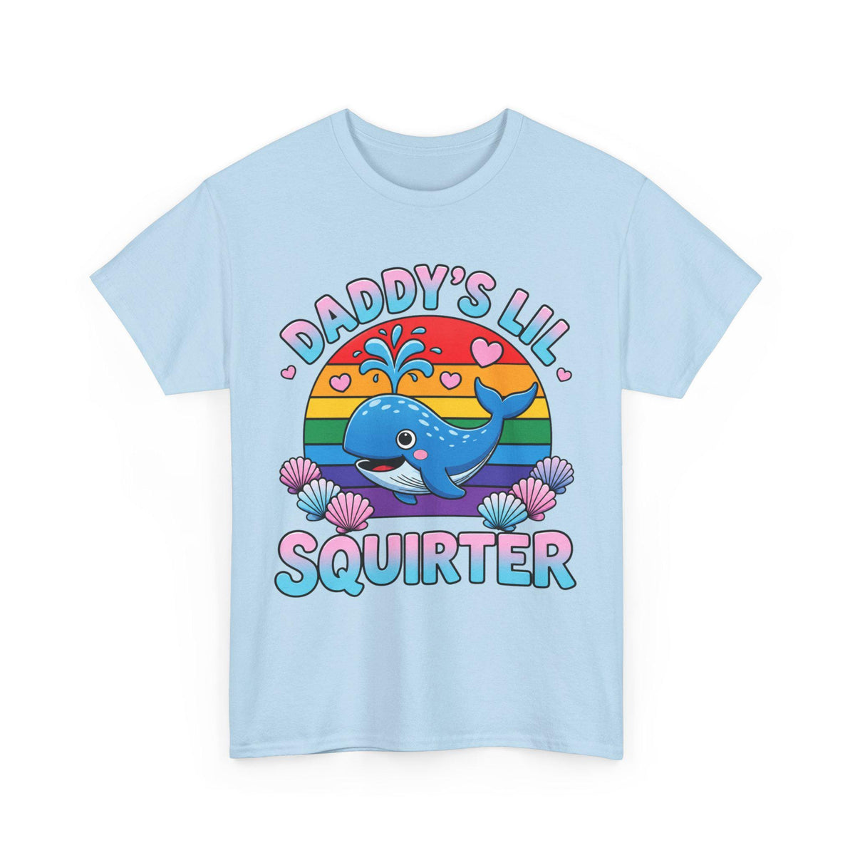 May include: A light blue t-shirt featuring a graphic of a blue whale spraying water, set against a rainbow-colored sun. The text DADDY'S LIL SQUIRTER is printed in pink and blue letters, surrounded by small pink hearts and several seashells.