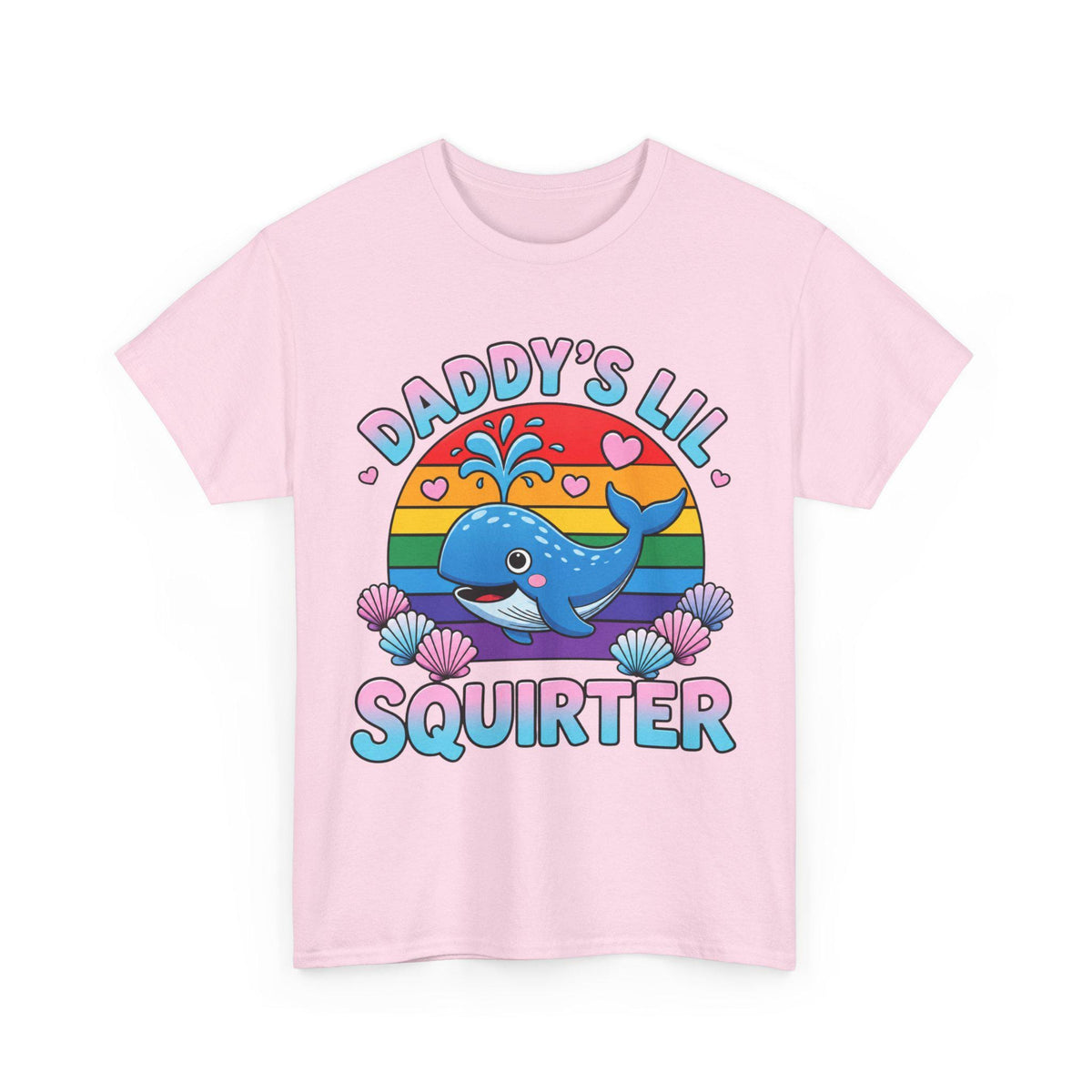 May include: A light pink t-shirt featuring a graphic of a blue whale spraying water in front of a rainbow sun. The text DADDY'S LIL SQUIRTER is printed in blue and pink letters, surrounded by small pink hearts and colorful seashells at the bottom.