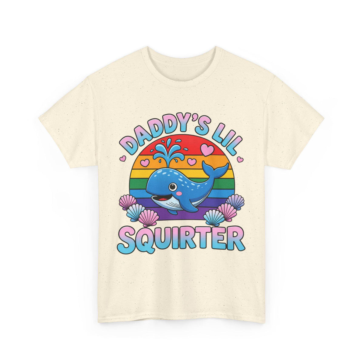 May include: A cream-colored short-sleeve t-shirt featuring a graphic of a blue whale spraying water in front of a rainbow-colored sun. The text "DADDY'S LIL SQUIRTER" is printed in blue and pink letters, surrounded by small pink hearts and seashells.