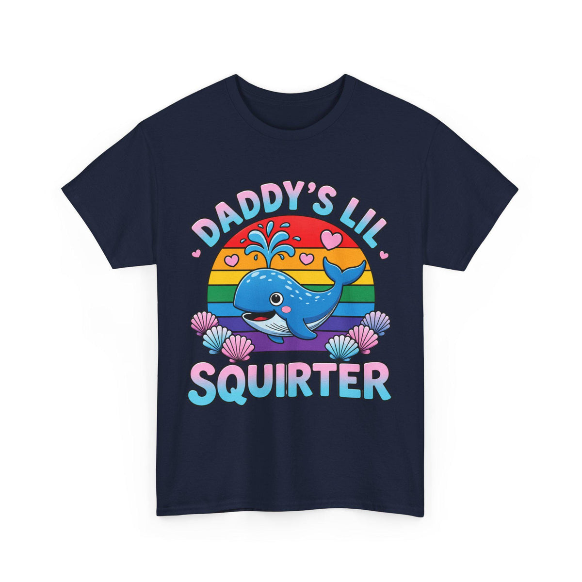 May include: A navy blue t-shirt featuring a graphic of a blue whale spraying water, set against a rainbow-colored semi-circle. The text reads DADDY'S LIL SQUIRTER in a gradient font, surrounded by small pink hearts and colorful seashells.
