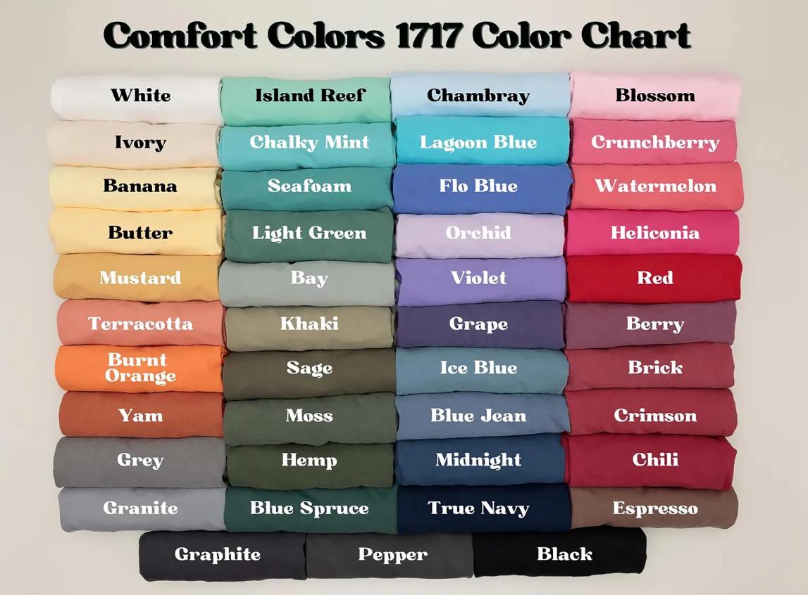 May include: A Comfort Colors 1717 color chart displaying a grid of folded t-shirts in various shades including white, ivory, banana, butter, mustard, terracotta, burnt orange, yam, grey, granite, graphite, pepper, black, and many other colors.